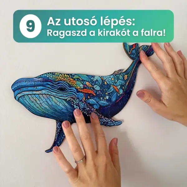 Színes bálnás kirakó rögzítése a falra kézzel.